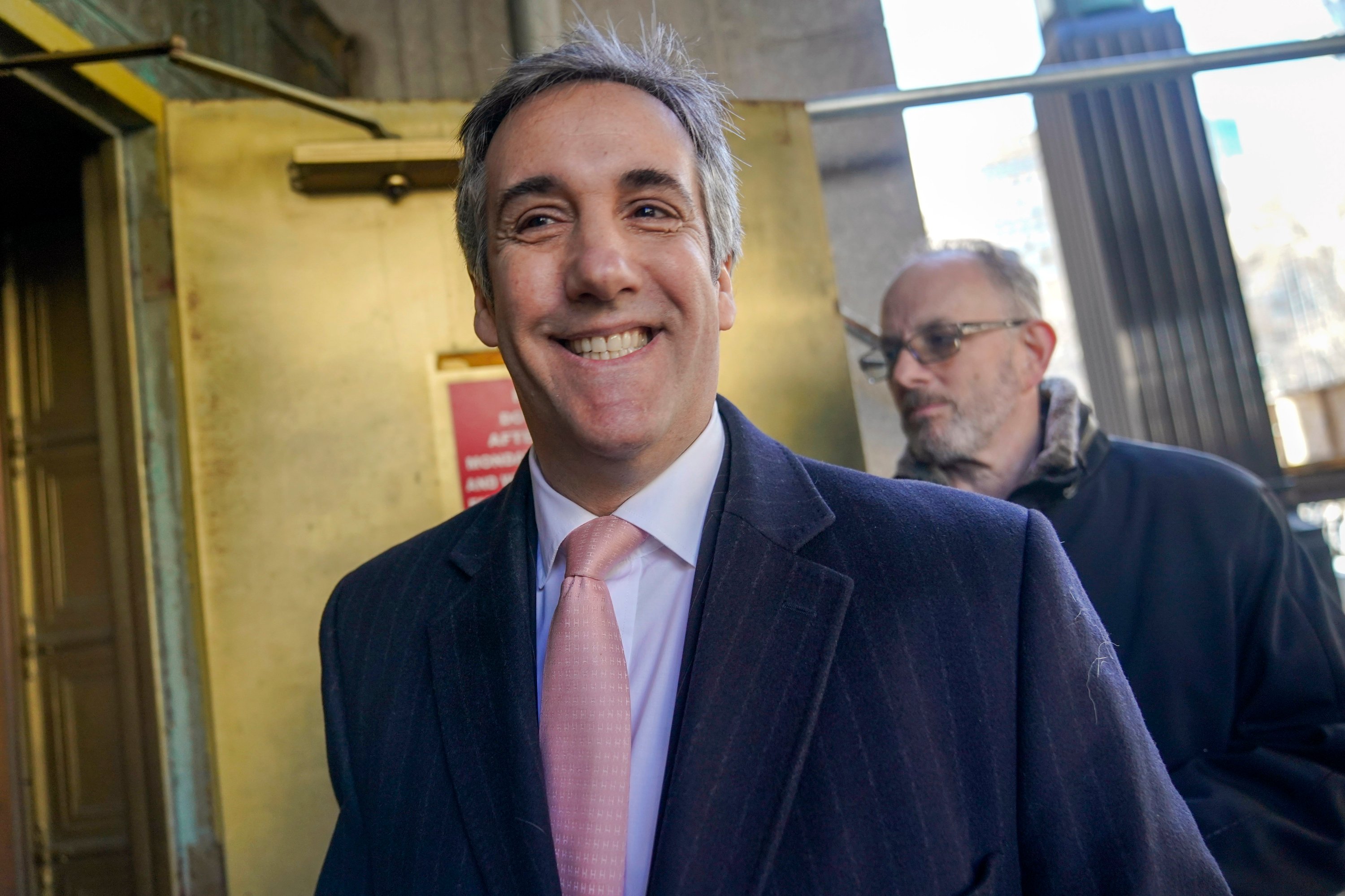 FILE - Michael Cohen leaves the District Attorney's office after