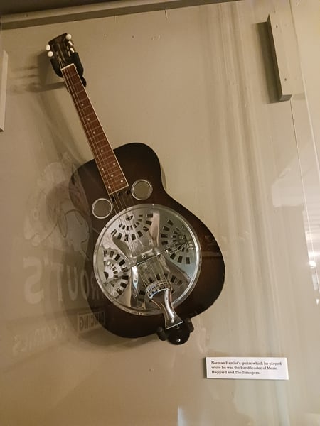 This guitar belonged to Norman Hamlet, band leader for Merle Haggard and the Strangers. Hamlet originally played with The Maddox Brothers and Rose as well as Johnny Cash before playing with The Strangers from 1965 to 1987.