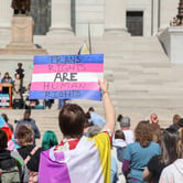 Protesters hold signs in support of transgender care for minors at the Missouri State Capitol on March 29, 2023. (Credit: Be Lovely Photography.)