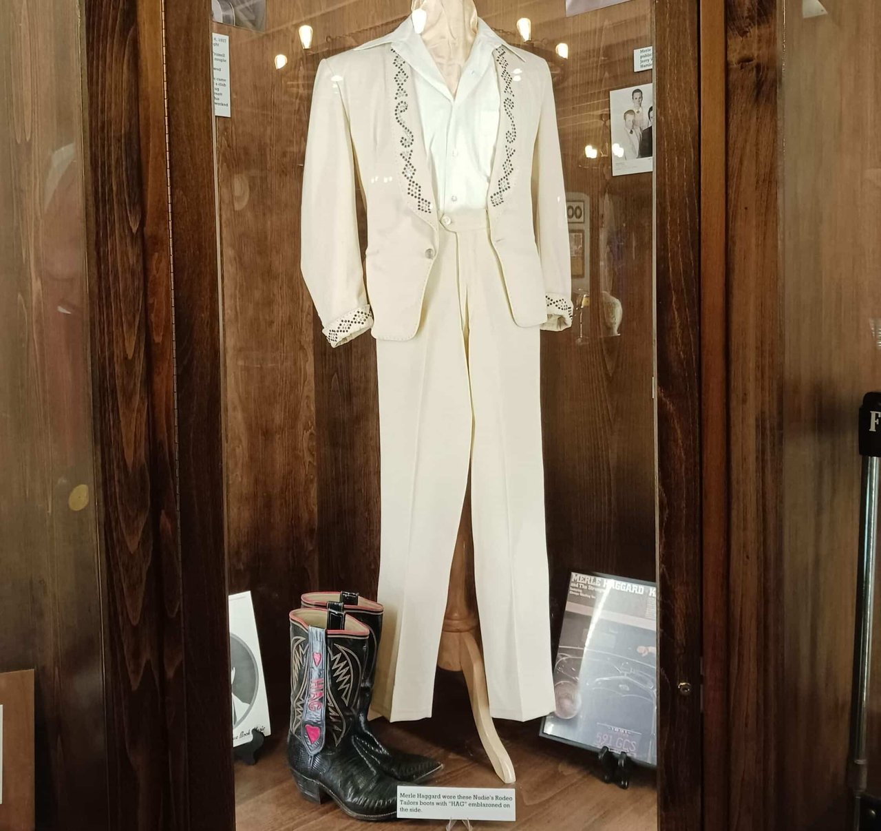 A decorative white suit with black cowboy boots.