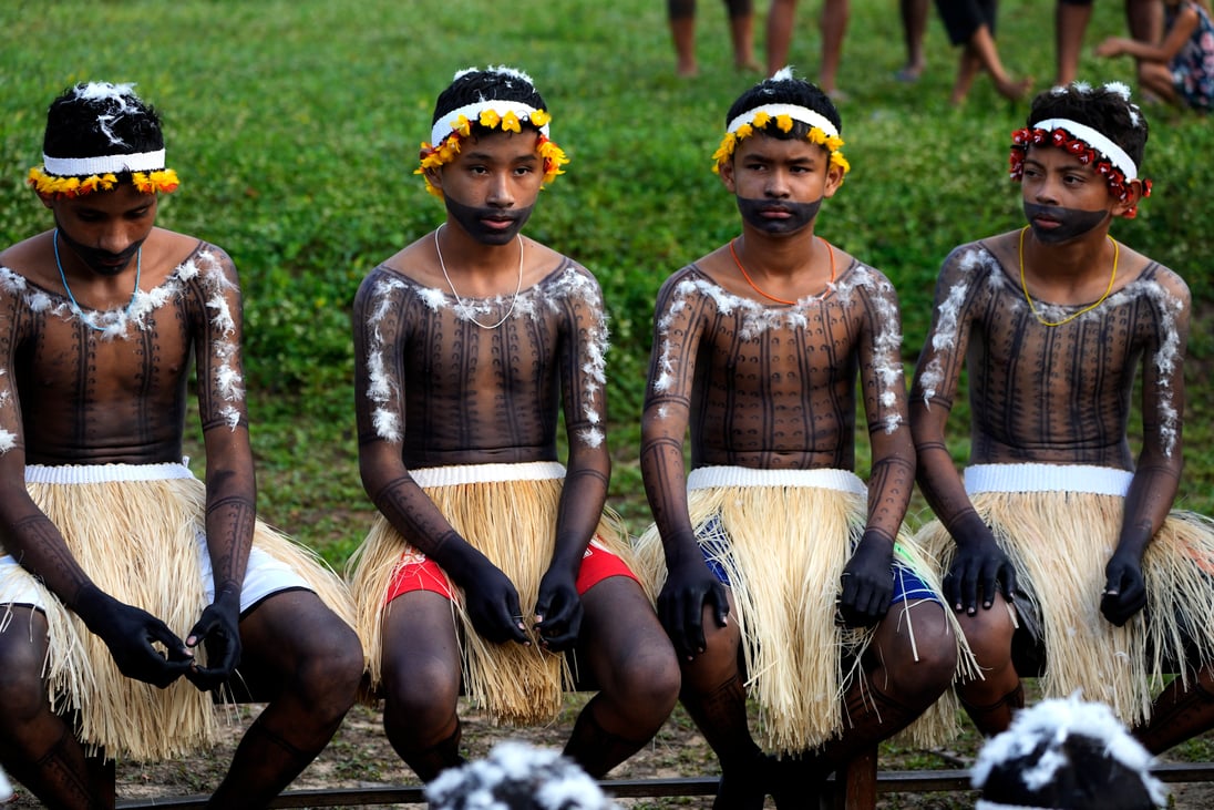 An Amazon rainforest rite of passage in threatened territory ...