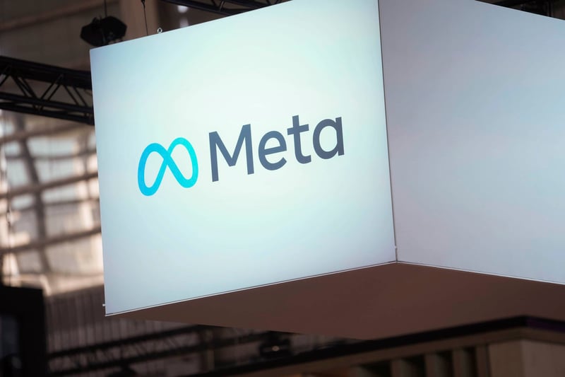 The Meta logo is displayed on a screen.
