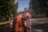 Shirtless man cools off