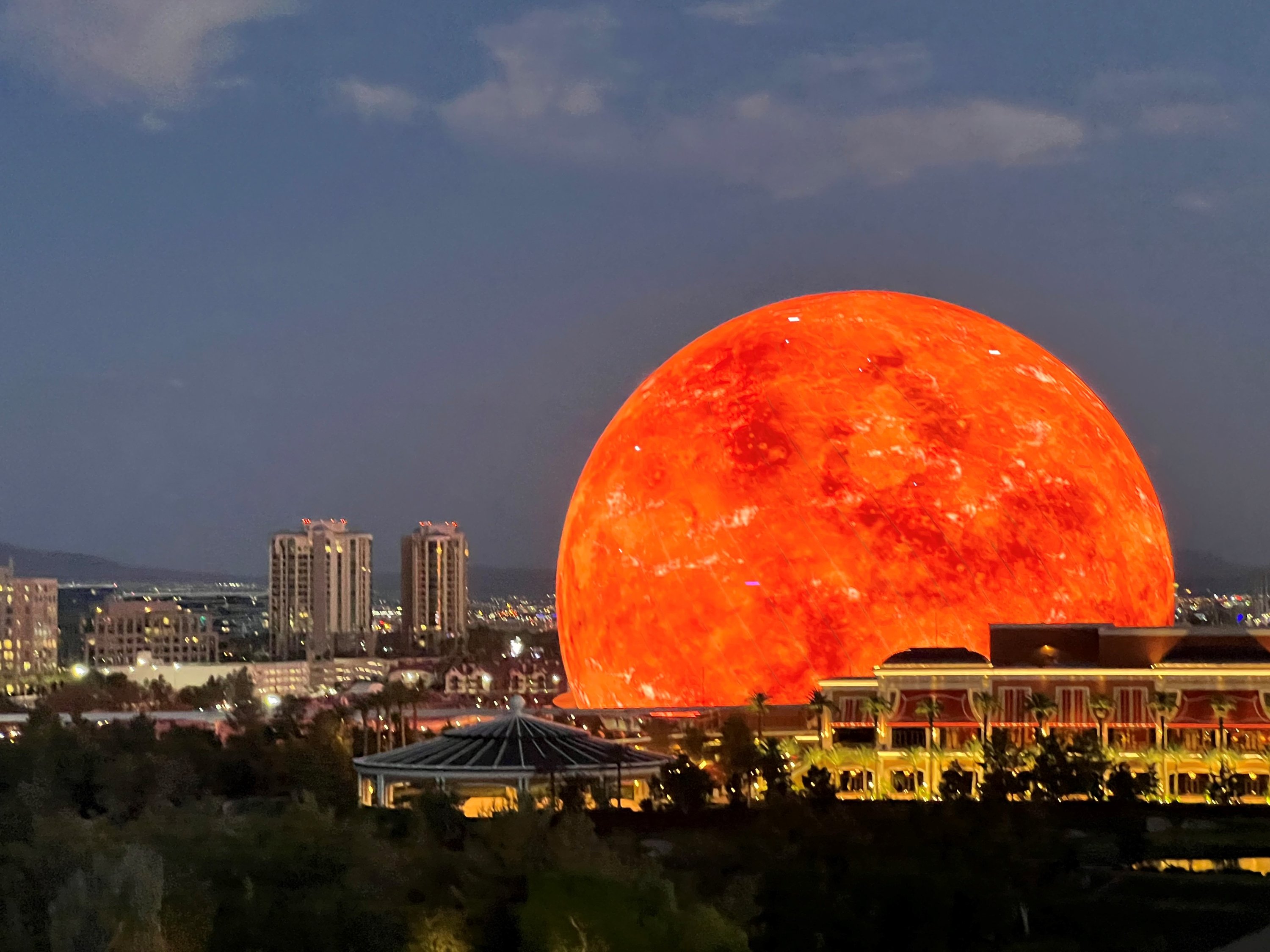 photo of the Sphere in Las Vegas glowing red like a planet