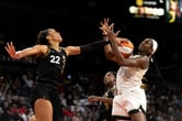 The Las Vegas Aces' A'ja Wilson blocks a shot attempt by the Chicago Sky's Elizabeth Williams during a WNBA game.
