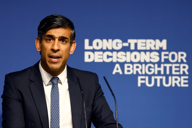 Rishi Sunak speaks on stage during an event.