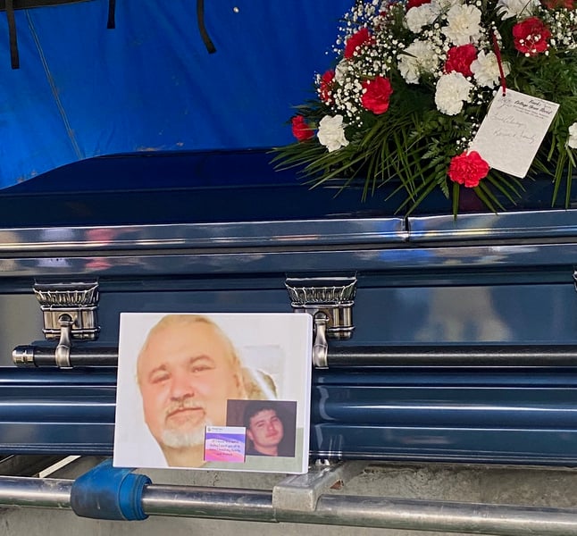 A coffin is shown with picturs of Brandon Jones.