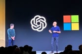 Satya Nadella gestures while speaking on stage with Sam Altman during the first OpenAI DevDay.