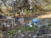 Trash and debris in abandoned homeless camp