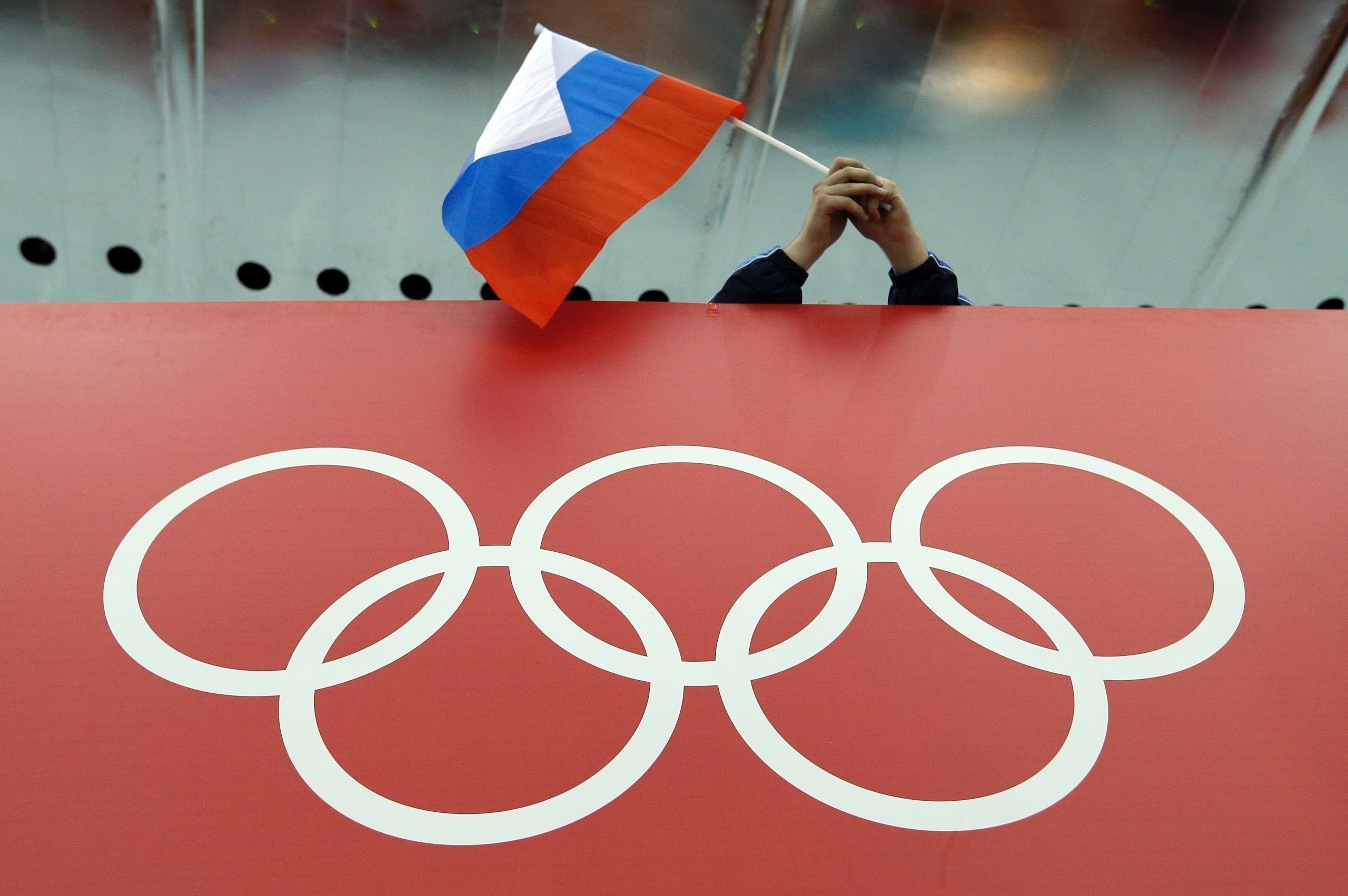 we love Russia, A group of people pose next to the Russian flag ilustração  do Stock