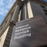 An IRS building with a sign in front.
