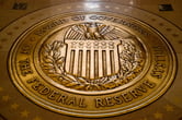The seal of the Board of Governors of the Federal Reserve on a floor at the Federal Reserve Board Building.
