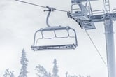 A chairlift crusted in snow.