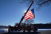A fire truck with a U.S. flag at half mast.
