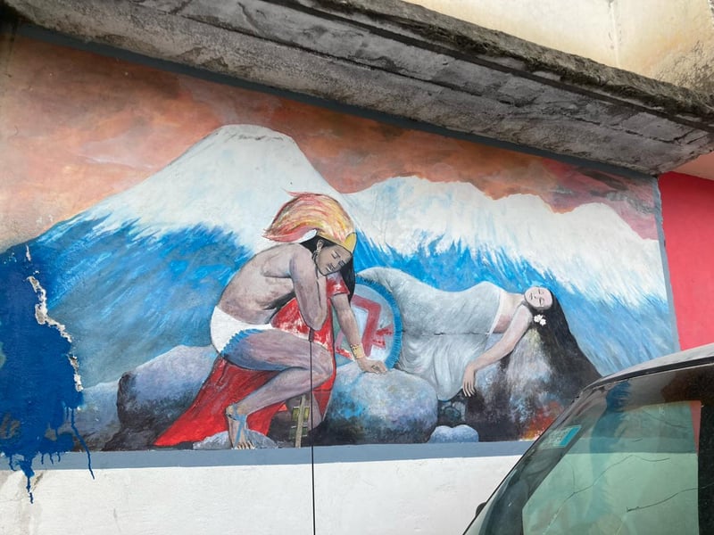 A mural of the legend of popocatepetl and Iztaccihuatl in Santiago Xalinzintla, Puebla, Mexico.
