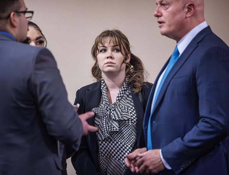 Hannah Gutierrez-Reed speaks with her defense team during her trial.