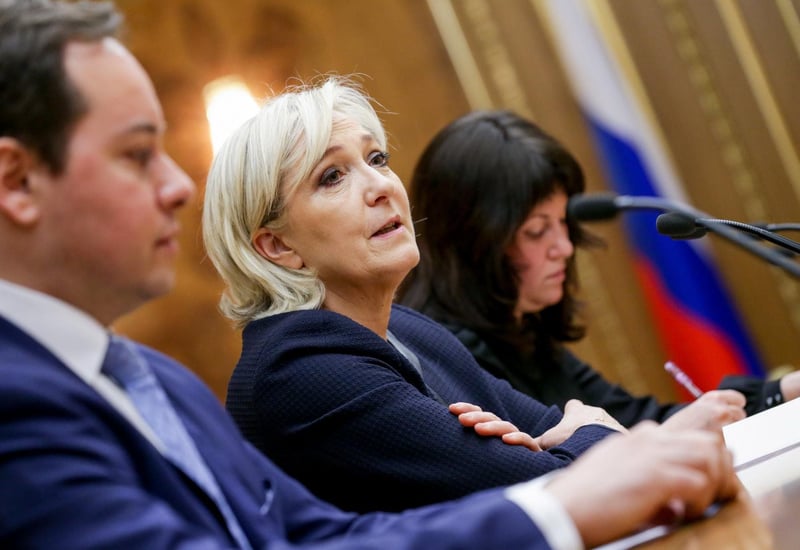 Marine Le Pen speaks with members of the State Duma