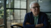 Steve Martin sits with his arms folded in scene from the documentary "Steve! (Martin) a Documentary in 2 Pieces."