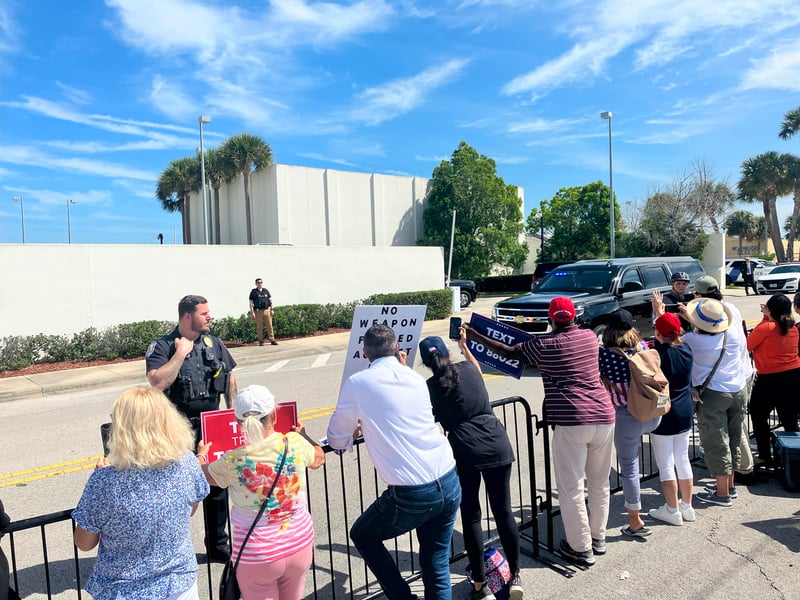 Supporters cheer for former president Donald Trump as his motorcade leaves a federal court hearing in Fort Pierce, Florida.