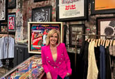 Alisyn Camerota leans against a pinball machine while posing for a photo in the former location of the CBGB nightclub.