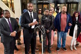 Bakari Sellers speaks while standing next to Ricky Cobb II's family members during a news conference.