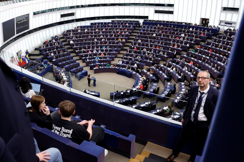 The EU Parliament floor with members seated.
