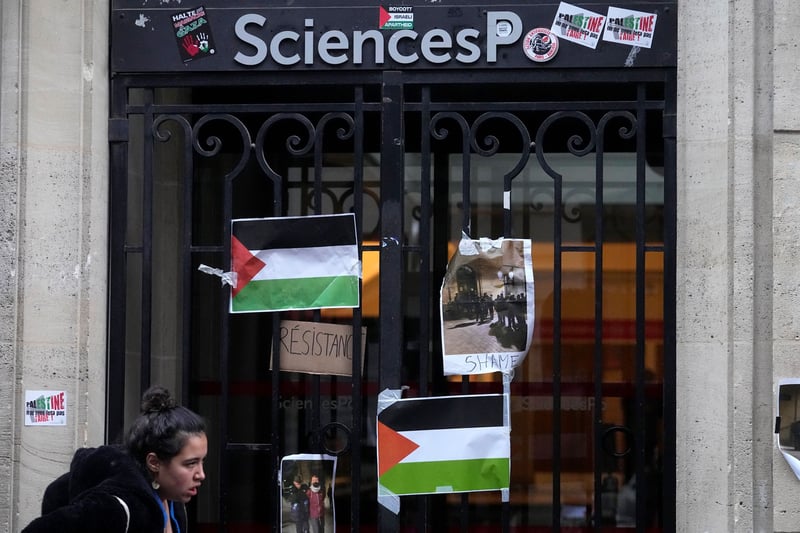 A door marked "SciencesPo" with Palestinian flags.