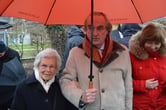 Heinrich Reuss with his mother under an umbrella.