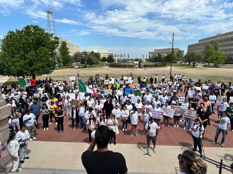 Dozens of people gather at the Oklahoma Capitol for a protest over an anti-immigration bill.
