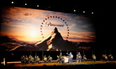 Several people dressed as gladiators gather on a stage during a Paramount Pictures presentation at CinemaCon 2024.