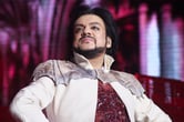 Philipp Kirkorov looks proudly over his shoulder.