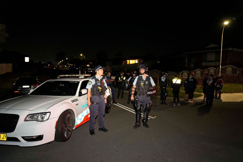 Police in Sydney stand in the street