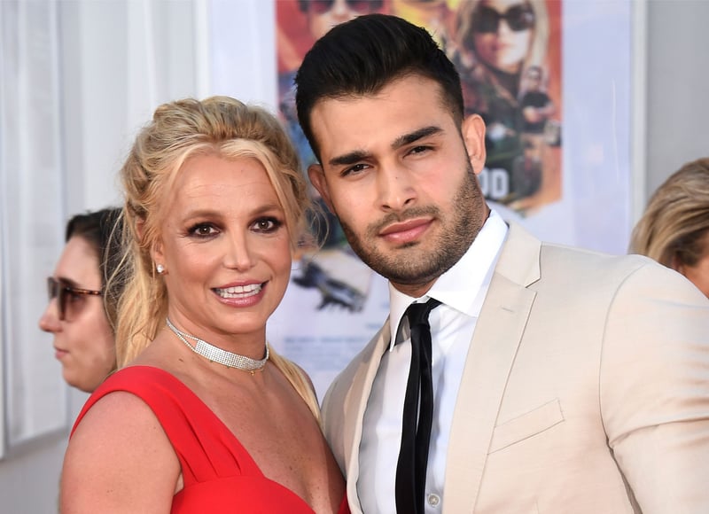 Britney Spears and Sam Asghari pose for a photo together.