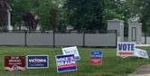 Candidate yard signs outside of an Indiana polling location