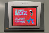 A Unitronics device screen displaying a message indicating that the device has been hacked.
