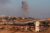 Smoke rises near the Egypt-Rafah border crossing.