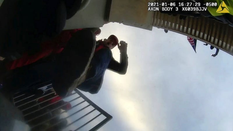 A still image from body-worn camera video showing with his foot in the air during the Jan. 6, 2021, U.S. Capitol riot.
