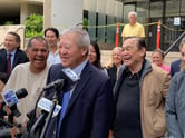 Greeting the not guilty verdicts with joy, former Honolulu Prosecuting Attorney Keith Kaneshiro, foreground, and prominent Hawaii businessman Dennis Mitsunaga celebrated their courtroom triumph after being acquitted of corruption counts Thursday at the U.S. District Court in Honolulu.