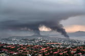 smoke rises from town in new caledonia protests