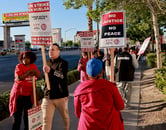 Union members hold signs during a strike at the Virgin Hotels in Las Vegas.