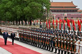 Xi Jinping and Vladimir Putin review the honor guard in Beijing.