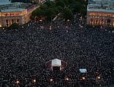 Thousands of people protest in an Armenian square.