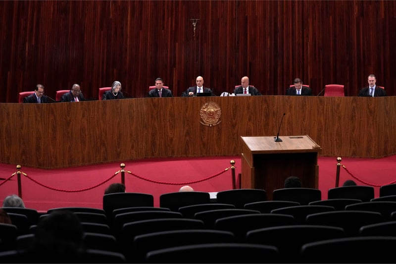 Brazilian Supreme Court justices preside over a trial from behind a long bench.