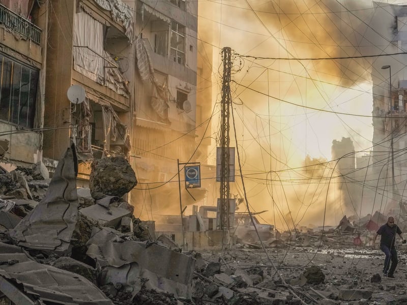 Israeli airstrikes rock southern suburbs of Beirut and cut off a key ...
