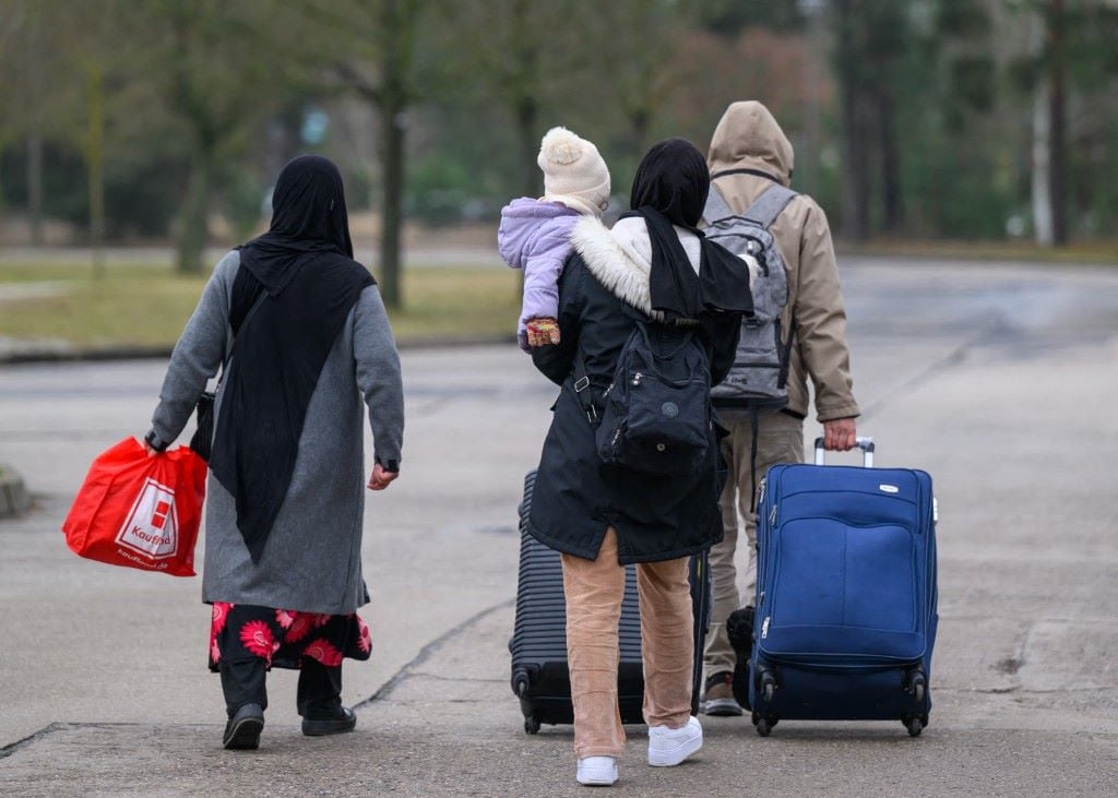 French bid to sink EU migration pact hits troubled waters