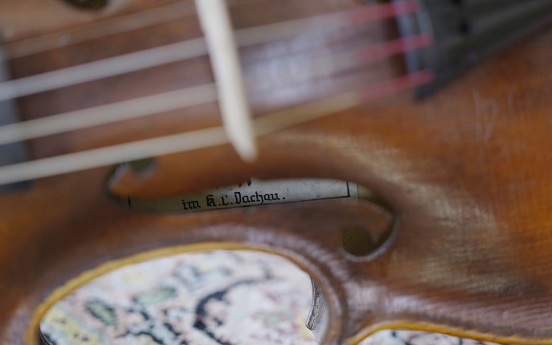A secret note hidden in Dachau-built ‘Violin of Hope’ tells a tale of survival and craftsmanship