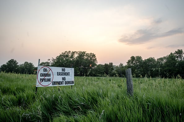 A sign against a proposed carbon dioxide pipeline outside a home in New Liberty, Iowa, US, on Sunday, June 4, 2023. The Biden administration is all-in on carbon capture and storage. But the pipelines needed to move the greenhouse gas around face stiff local opposition. Photographer: Miriam Alarcon Avila/Bloomberg via Getty Images