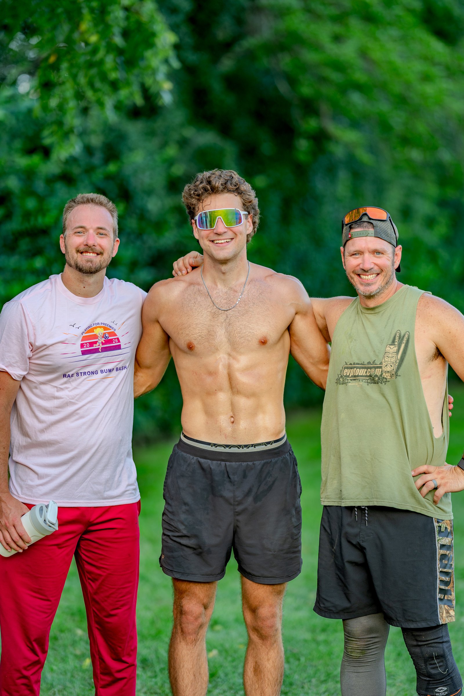 Three players in red, black, and green stand together at the Bump Bash #5 tournament.