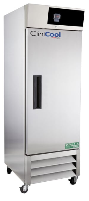 Clinicool labeled Series freezer with 23 Cu. Ft. interior capacity with stainless steel exterior that is closed with a black recessed handle and temperature display, also showing casters