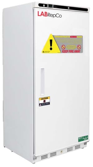 An upright Labrepco labeled hazardous location, explosion proof, 17 cu. ft. refrigerator with a closed solid door, recessed door handle and caution sticker